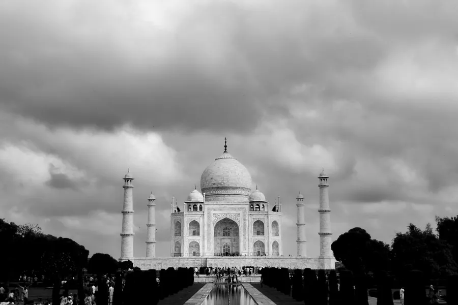 Taj Mahal reflected in water at sunrise