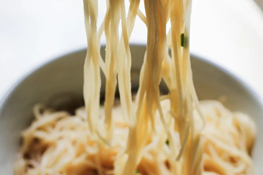 Bowl of steaming Japanese ramen with toppings